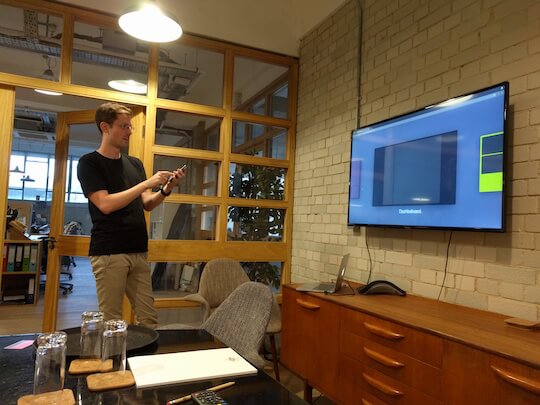 Leo demoing the Geckboard mobile "remote" at Show & Tell 34